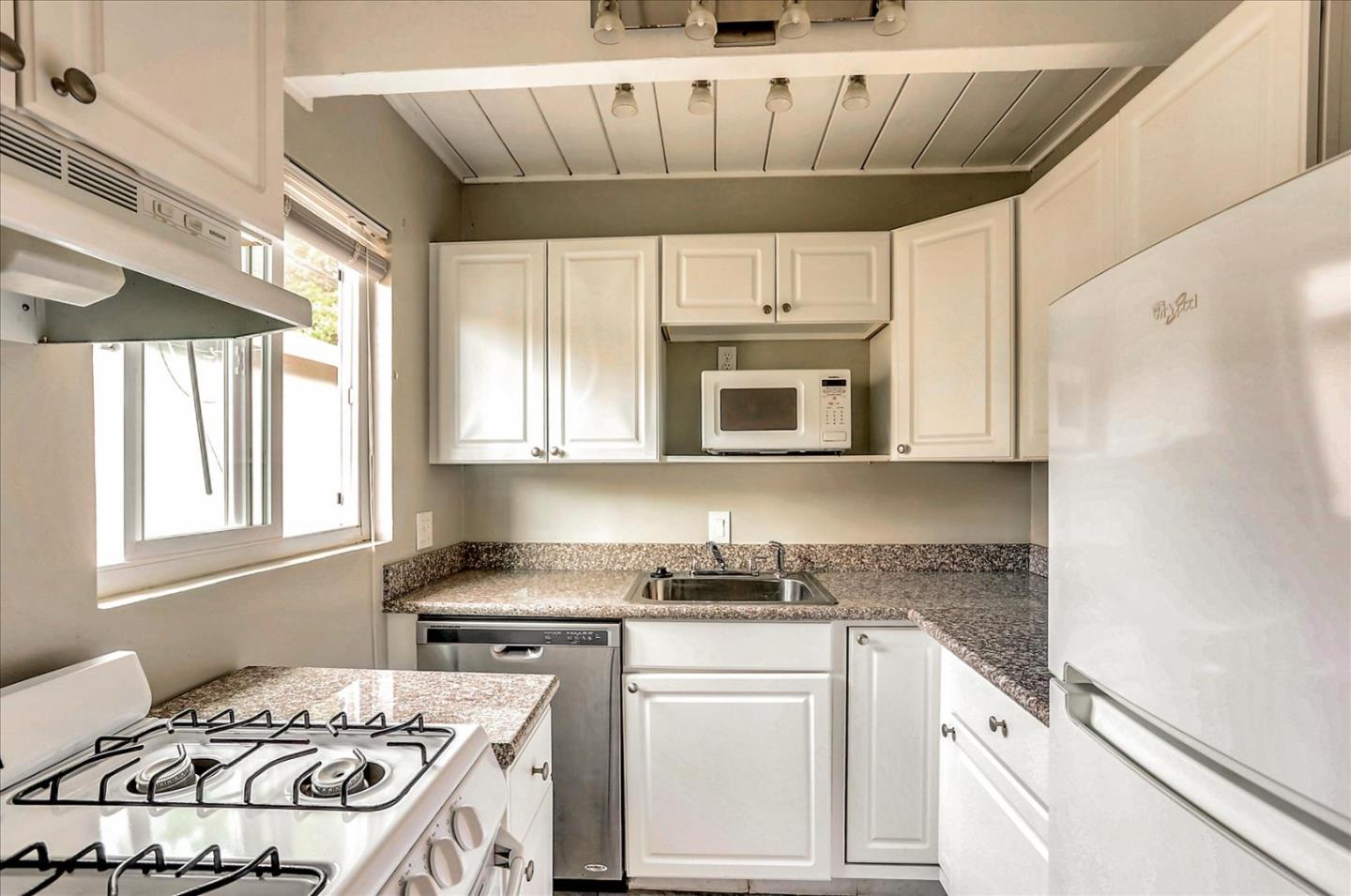 4 Coleman Place Menlo Park, CA 94025 - Photo 29 of 34 a kitchen with stainless steel appliances a stove a sink and a microwave