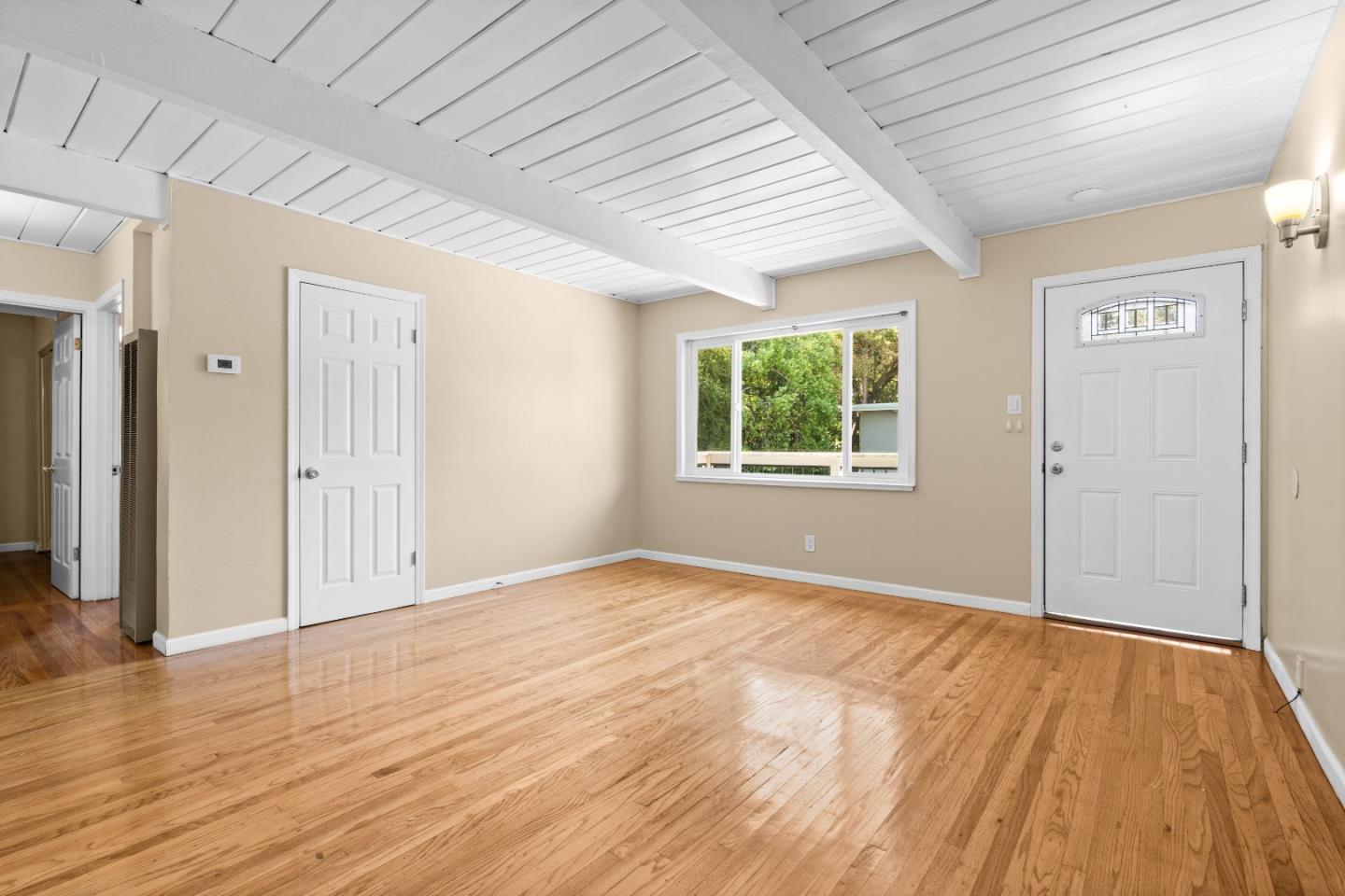 4 Coleman Place Menlo Park, CA 94025 - Photo 7 of 34 an empty room with wooden floor and windows