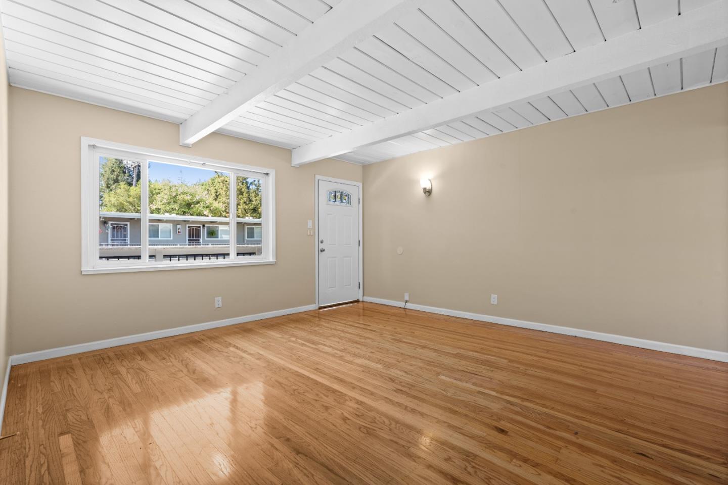 4 Coleman Place Menlo Park, CA 94025 - Photo 8 of 34 an empty room with wooden floor and windows