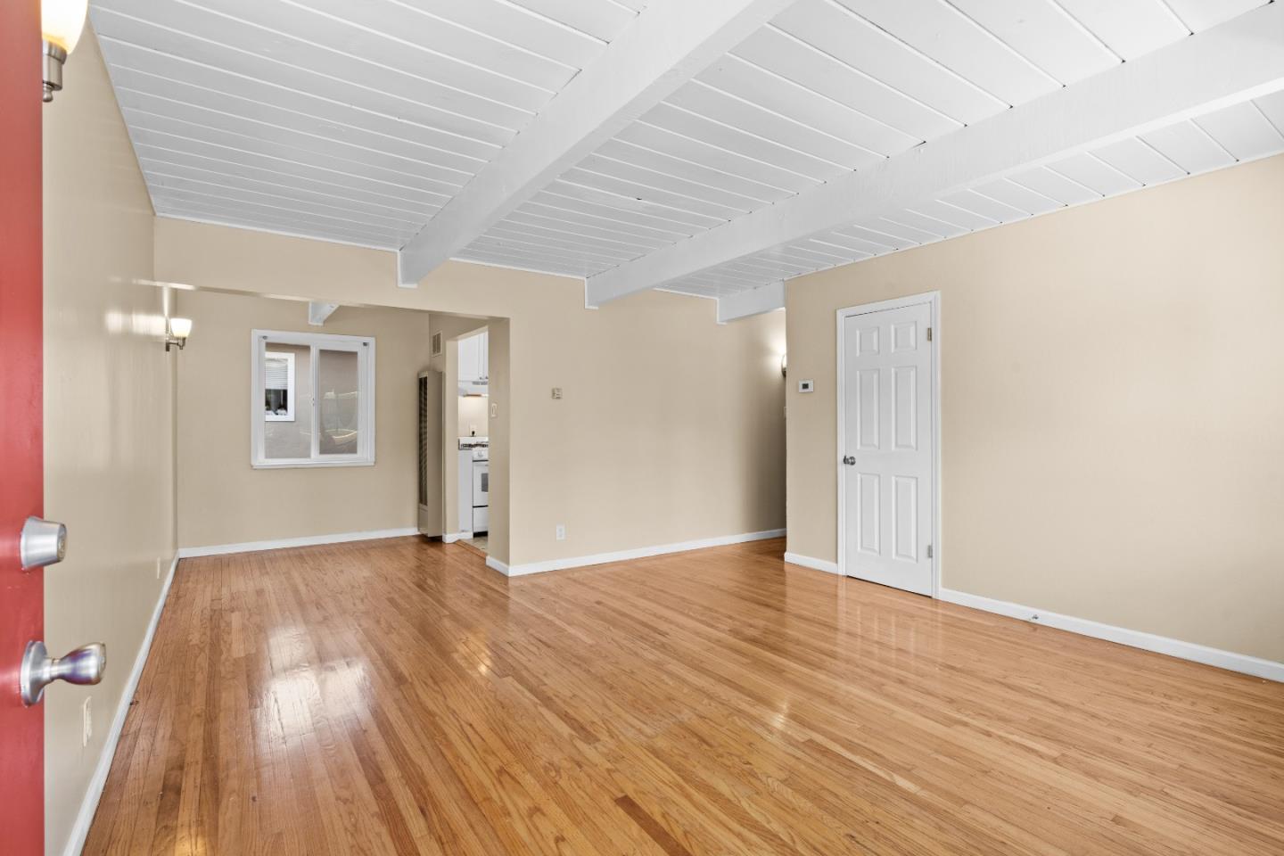 4 Coleman Place Menlo Park, CA 94025 - Photo 9 of 34 a view of an empty room with wooden floor and a window