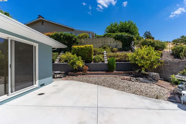 a view of a entryway door and potted plants