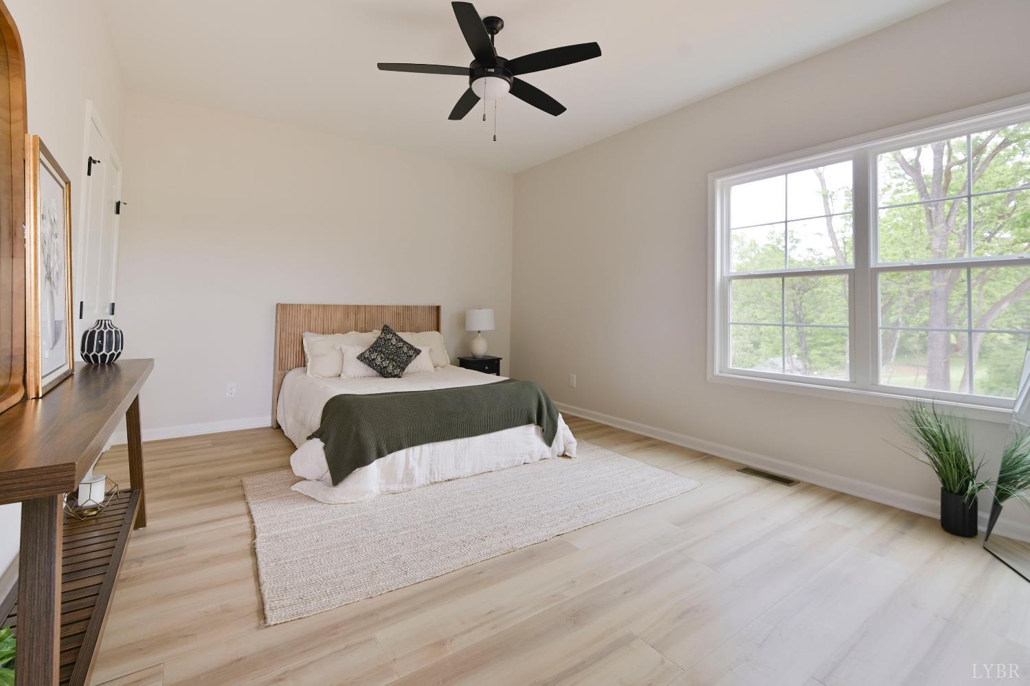 1843 Crockett Road Forest, VA 24551 - Photo 14 of 32 main level primary bedroom with dual closets
