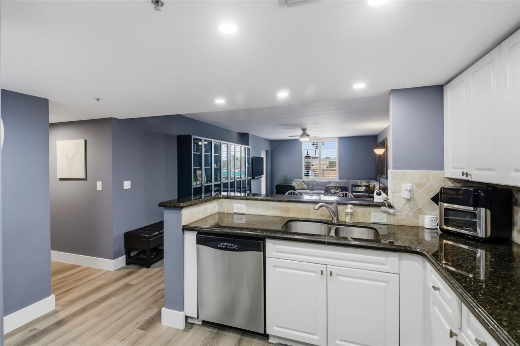 520 Southeast 5th Avenue, Unit 3208 Fort Lauderdale, FL 33301 - Photo 13 of 71 a kitchen with stainless steel appliances granite countertop a sink a stove and cabinets