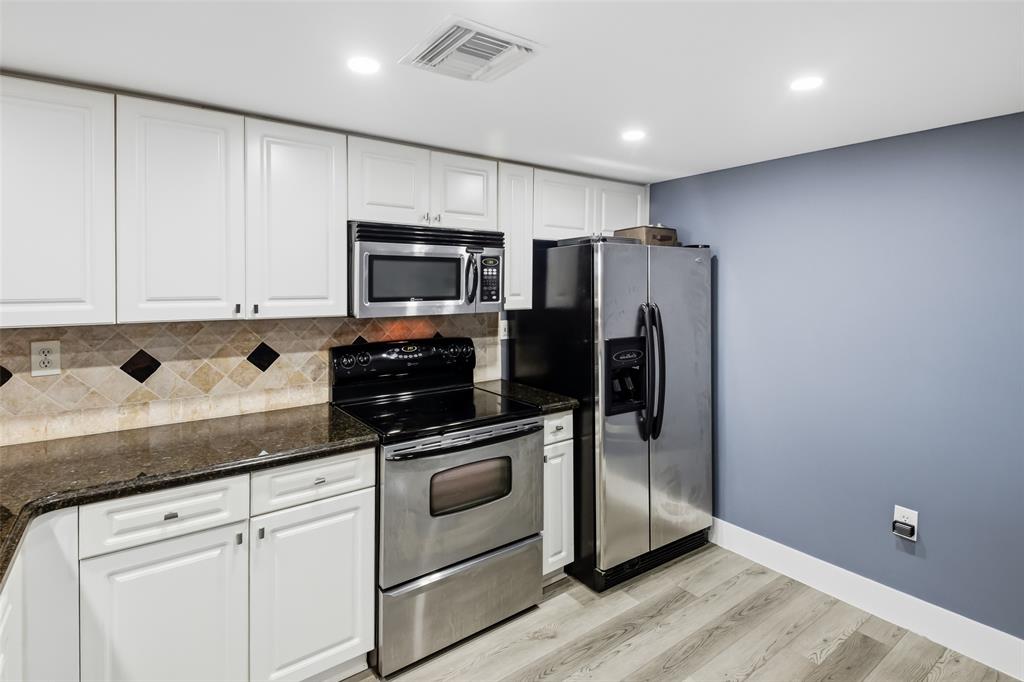 520 Southeast 5th Avenue, Unit 3208 Fort Lauderdale, FL 33301 - Photo 16 of 71 a kitchen with stainless steel appliances white cabinets and a refrigerator