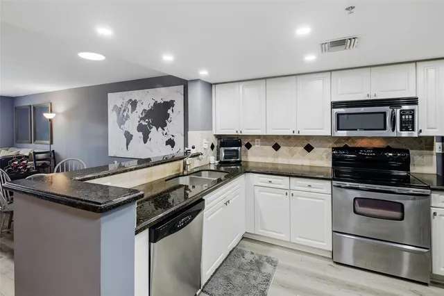a view of a livingroom with wooden floor