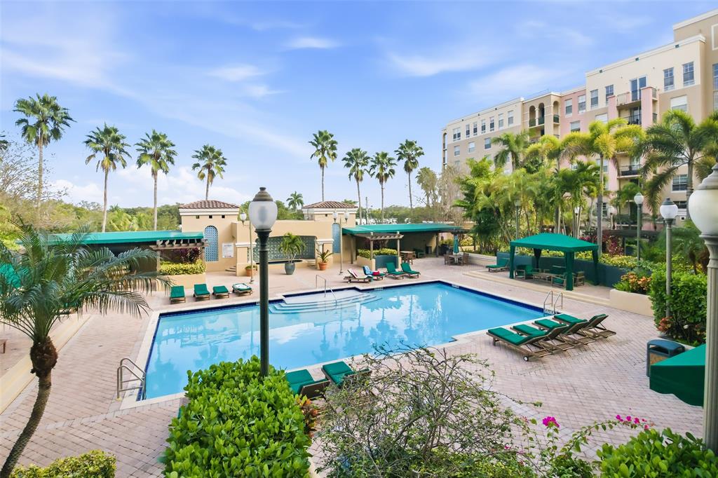 520 Southeast 5th Avenue, Unit 3208 Fort Lauderdale, FL 33301 - Photo 29 of 71 a swimming pool with outdoor seating and plants