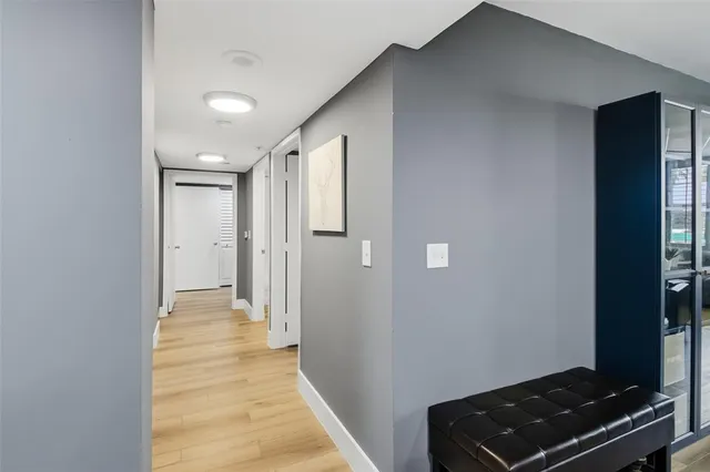 a room with a bed and a television