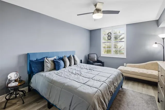 a view of a patio with table and chairs under an umbrella