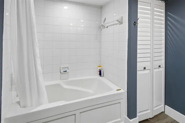 a view of a livingroom with furniture and a flat screen tv