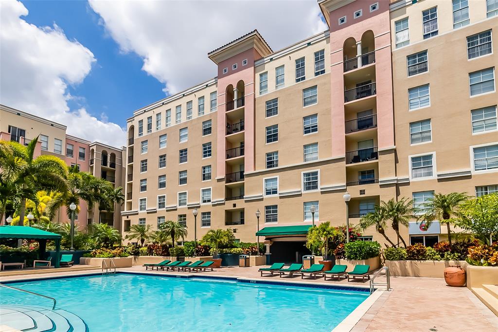 520 Southeast 5th Avenue, Unit 3208 Fort Lauderdale, FL 33301 - Photo 49 of 71 a front view of building with outdoor space water fountain and tall trees