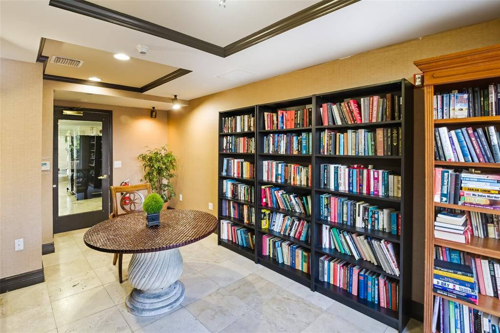 520 Southeast 5th Avenue, Unit 3208 Fort Lauderdale, FL 33301 - Photo 65 of 71 a table and a book in a room with a book shelf