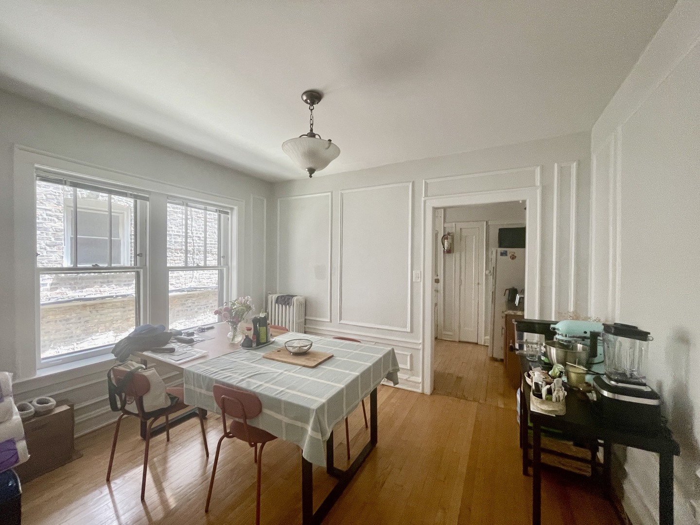 1112 Grove Street, Unit 1B Evanston, IL 60201 - Photo 9 of 14 a view of a dining room with furniture and window
