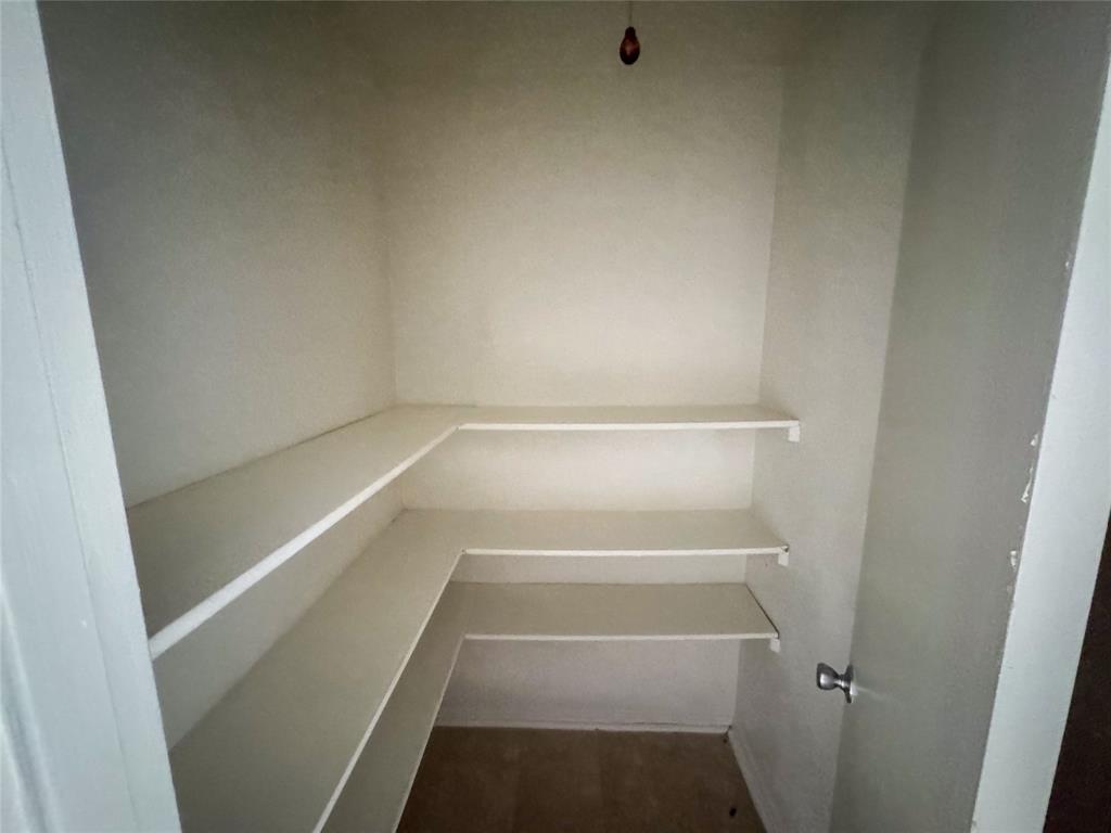 60 Pershing Drive, Unit A Denison, TX 75020 - Photo 10 of 11 a view of walk in closet with empty racks