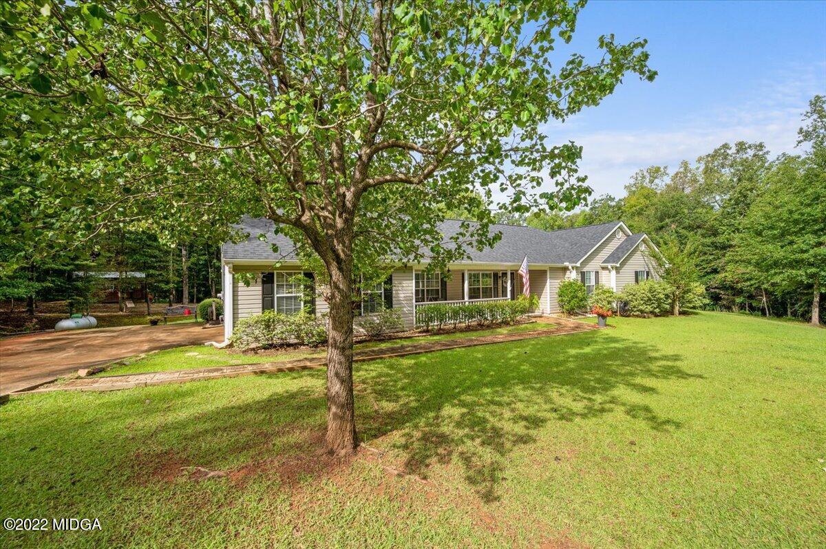 222 English Road Forsyth, GA 31029 - Photo 32 of 33 a front view of a house with yard and green space