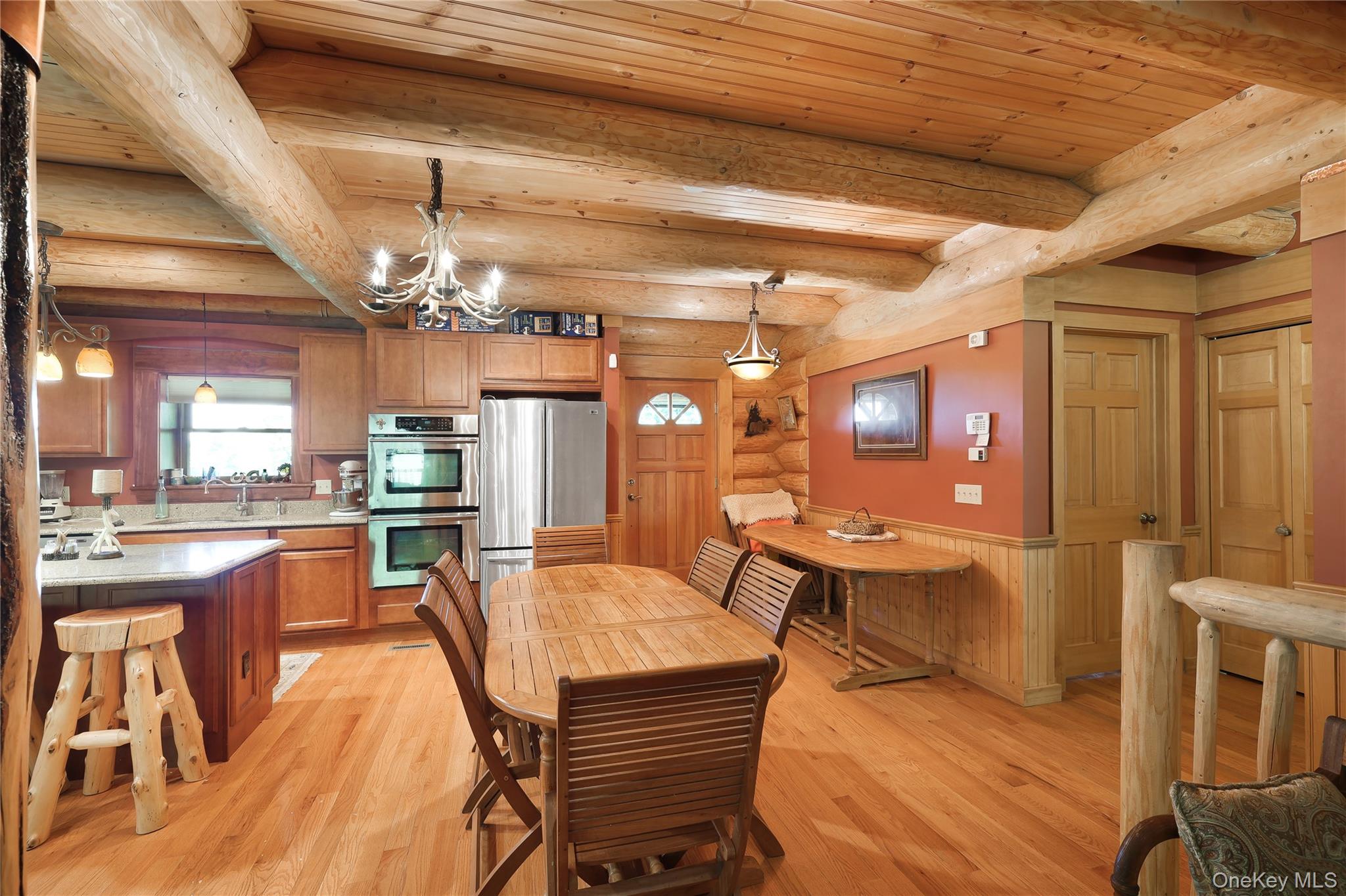 25 Cauthers Road Fallsburg, NY 12789 - Photo 12 of 27 a dining hall with stainless steel appliances kitchen island granite countertop furniture and a kitchen view