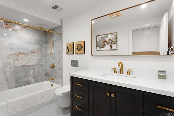 a bath tub sitting next to a shower