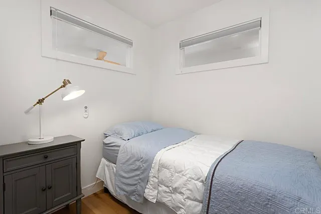 a view of a patio with table and chairs and potted plants