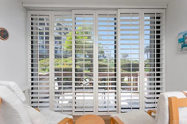 a bathroom with a sink a large mirror a bathtub and a shower