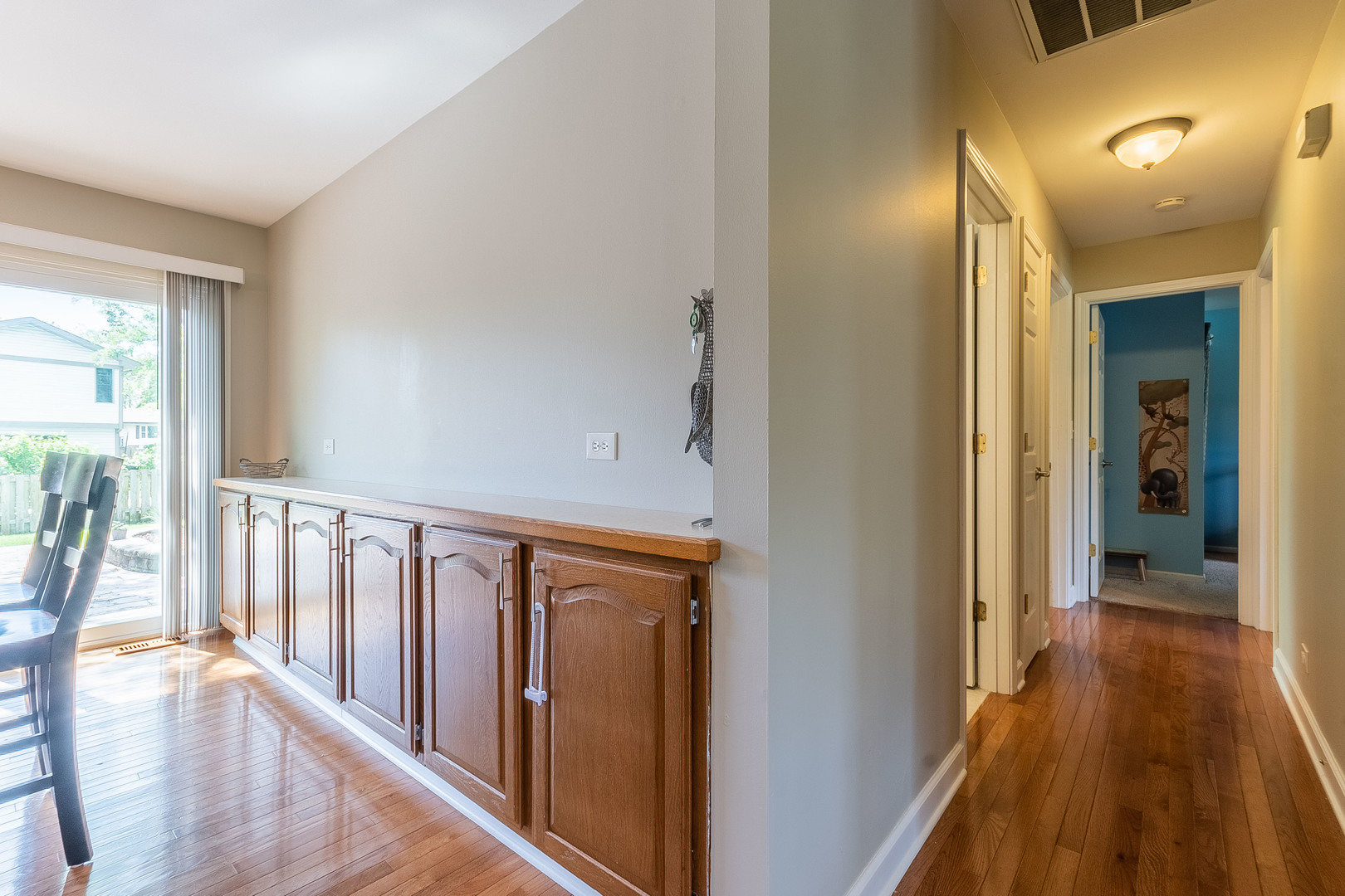 993 Pheasant Ridge Drive Lake Zurich, IL 60047 - Photo 21 of 25 a view of a hallway with wooden floor and staircase