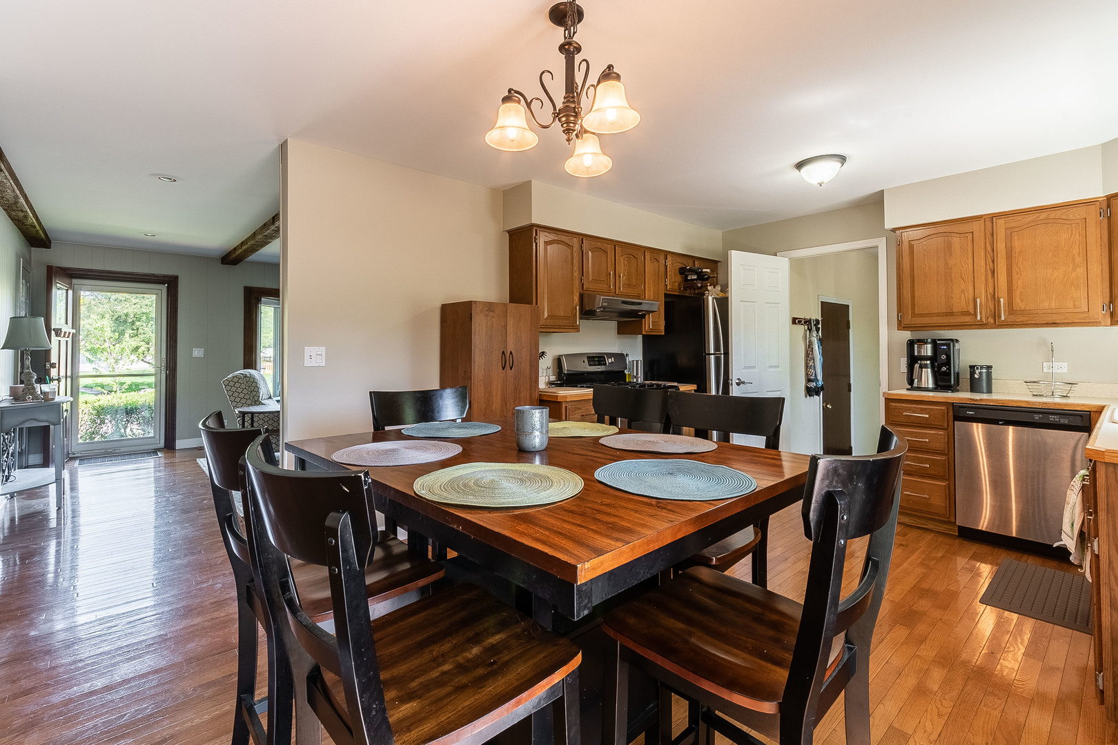 993 Pheasant Ridge Drive Lake Zurich, IL 60047 - Photo 7 of 25 a view of a dining room with furniture and wooden floor