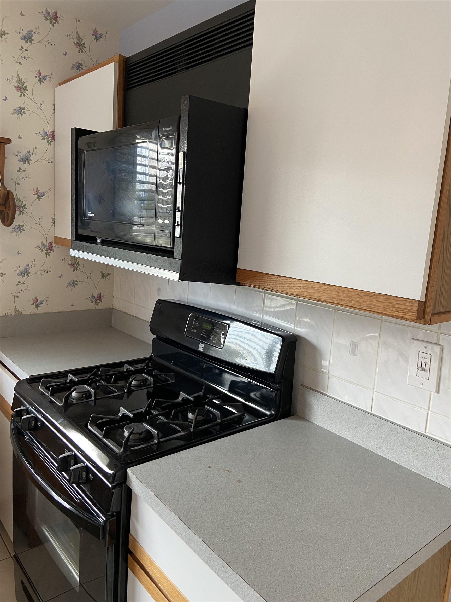 645 Sable Avenue Addison, IL 60101 - Photo 17 of 33 a close up of a stove top oven sitting inside of a kitchen