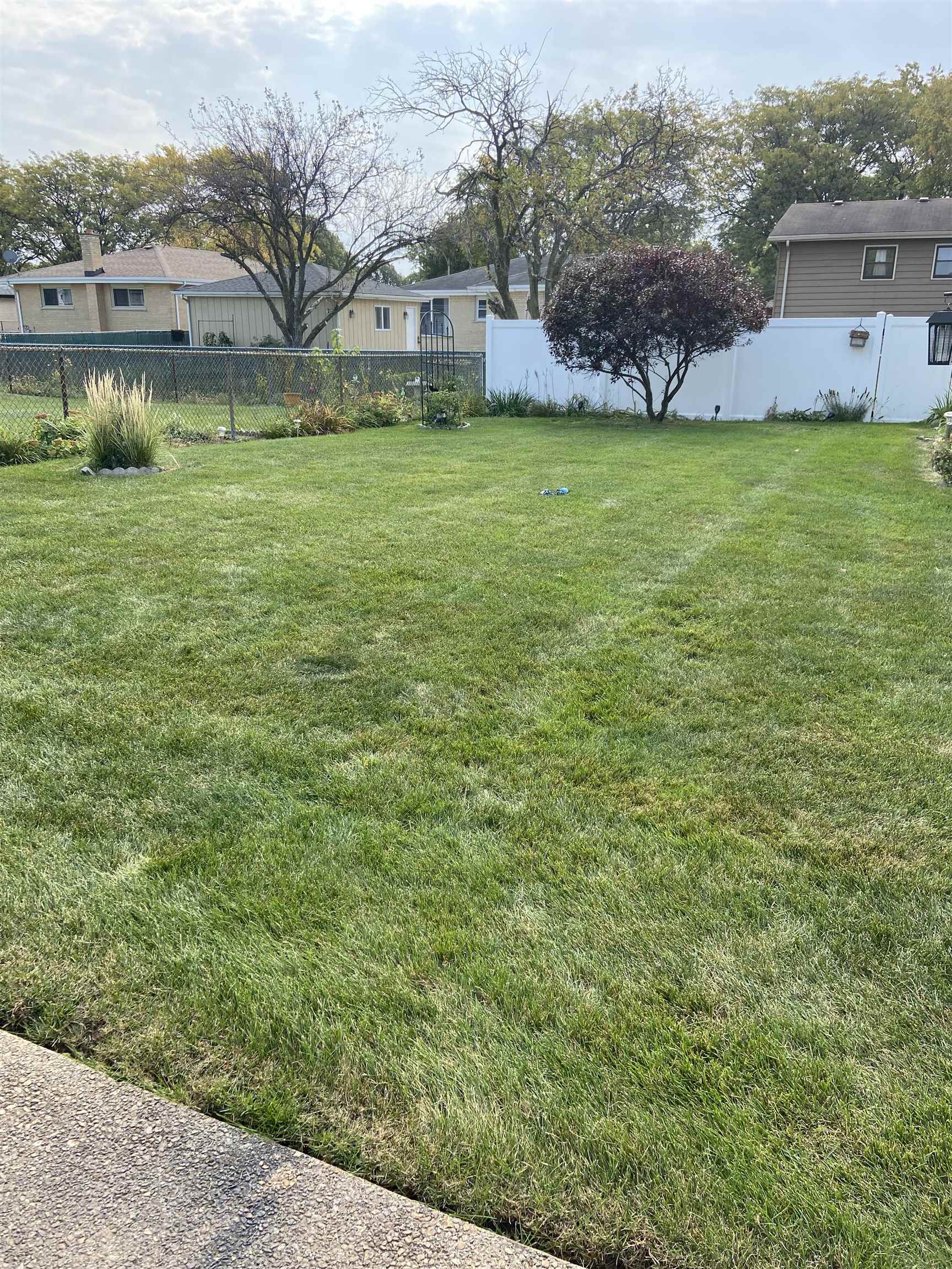 645 Sable Avenue Addison, IL 60101 - Photo 5 of 33 a front view of a house with a garden and lake view