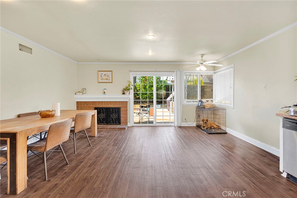 1087 Baseline Road La Verne, CA 91750 - Photo 11 of 39 a view of a livingroom with furniture a fireplace and wooden floor