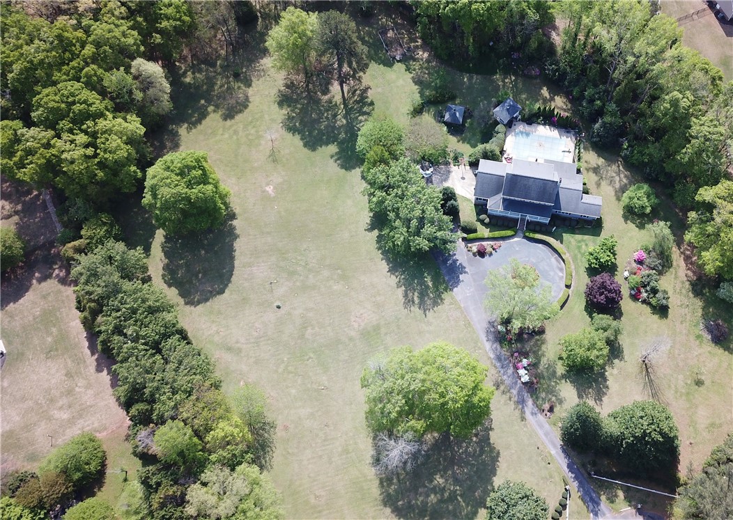 208 Knoxwood Court Anderson, SC 29621 - Photo 29 of 38 Expansive estate with a large private yard and inviting pool, nestled amongst mature trees.