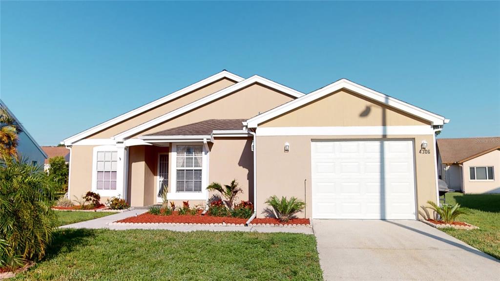4306 Waltham Lane New Port Richey, FL 34653 - Photo 1 of 1 a front view of a house with a yard