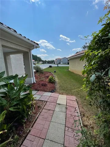 a backyard of a house with lots of green space