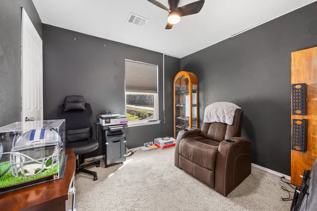 a living room with furniture and a window