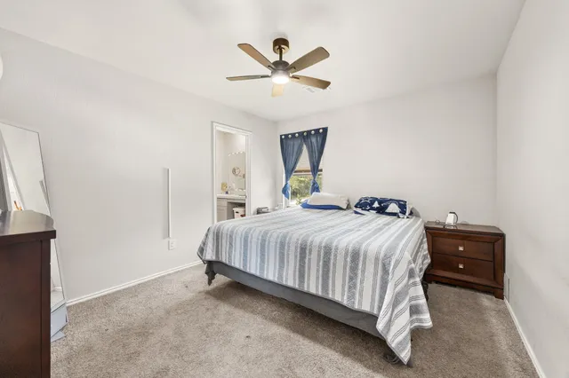 a bedroom with a bed and window