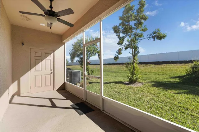 a view of a floor to ceiling window and an ocean view