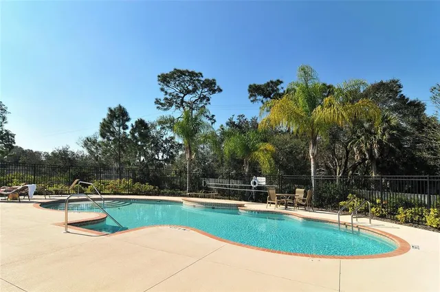 a view of swimming pool with chairs