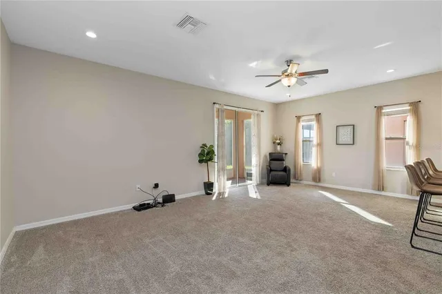 a view of a livingroom with furniture and windows