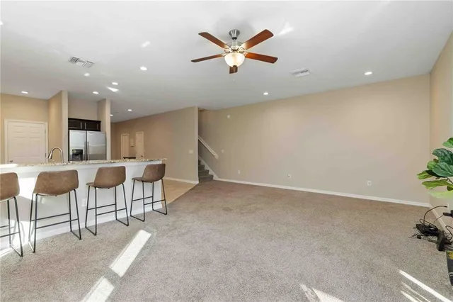 an open kitchen with table and chairs