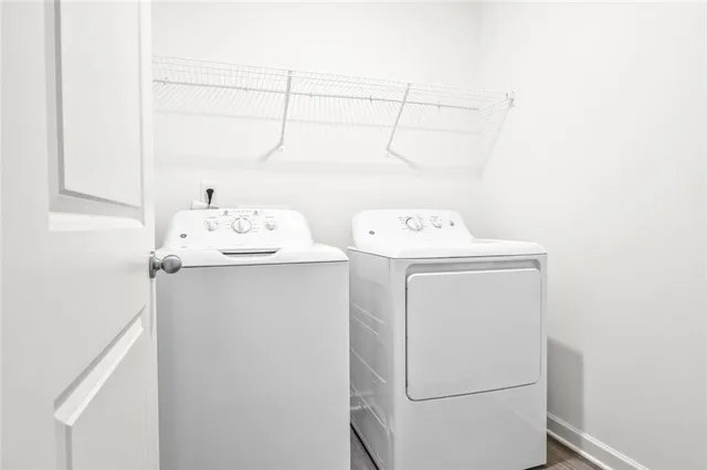 a utility room with dryer and washer