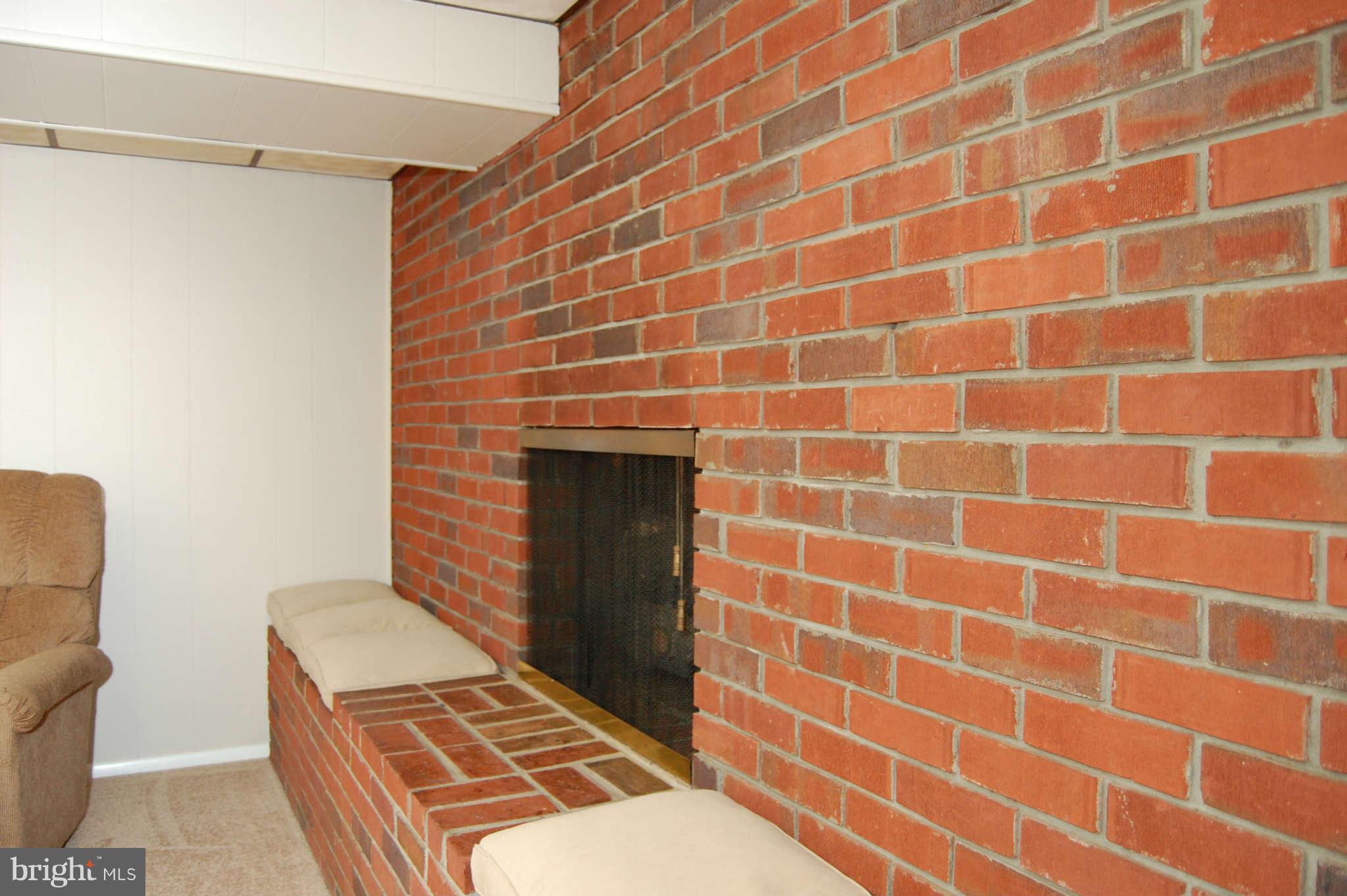 8001 Haas Lane Rosedale, MD 21237 - Photo 22 of 28 Brick Wall & Fireplace