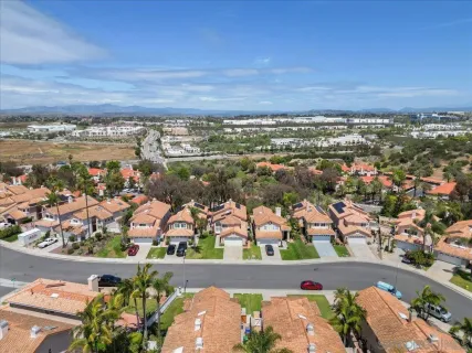 an aerial view of residential houses with outdoor space