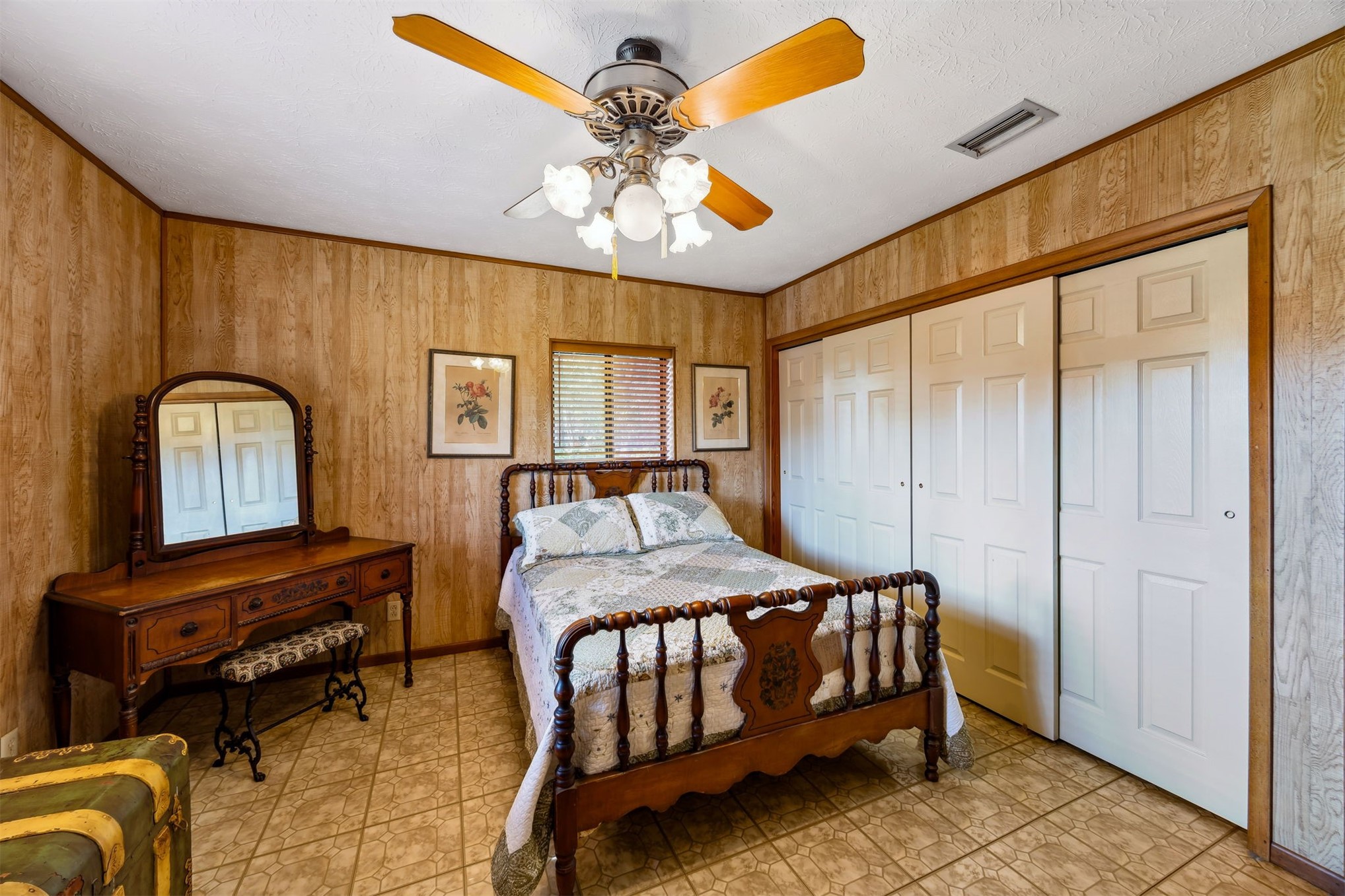 96111 Pirates Bluff Road Yulee, FL 32097 - Photo 21 of 52 a bedroom with a bed and a chandelier