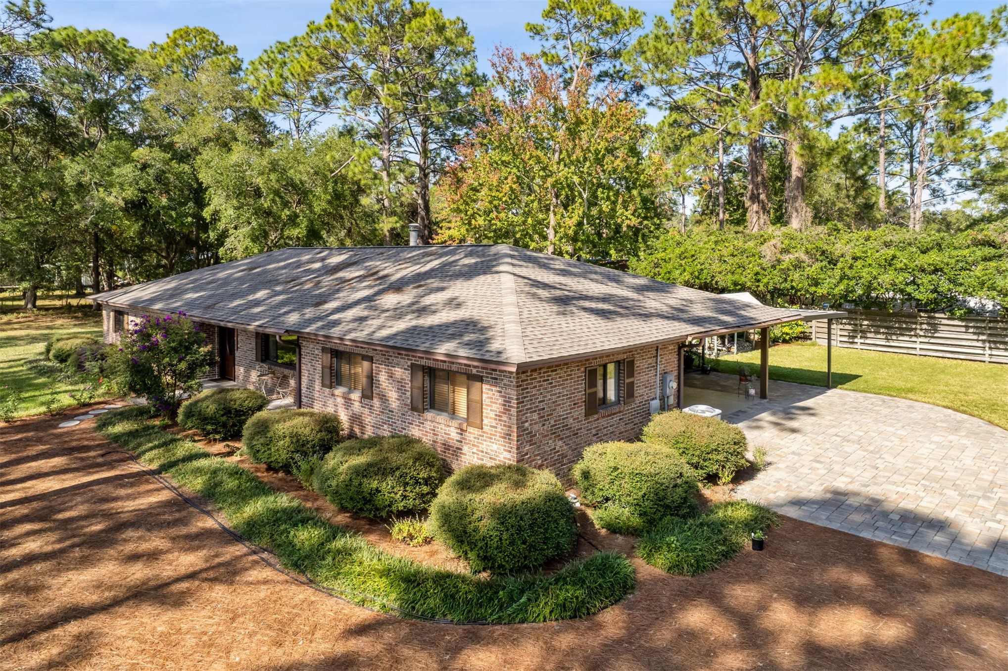 96111 Pirates Bluff Road Yulee, FL 32097 - Photo 33 of 52 a view of a house with a garden and plants