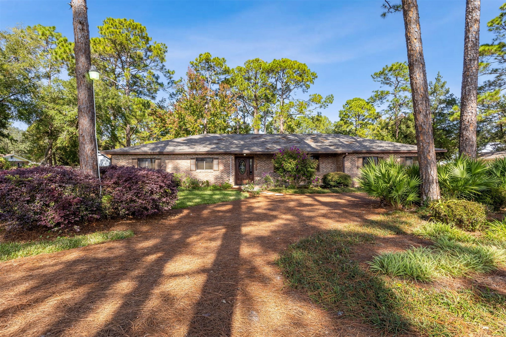 96111 Pirates Bluff Road Yulee, FL 32097 - Photo 34 of 52 a front view of a house with a yard