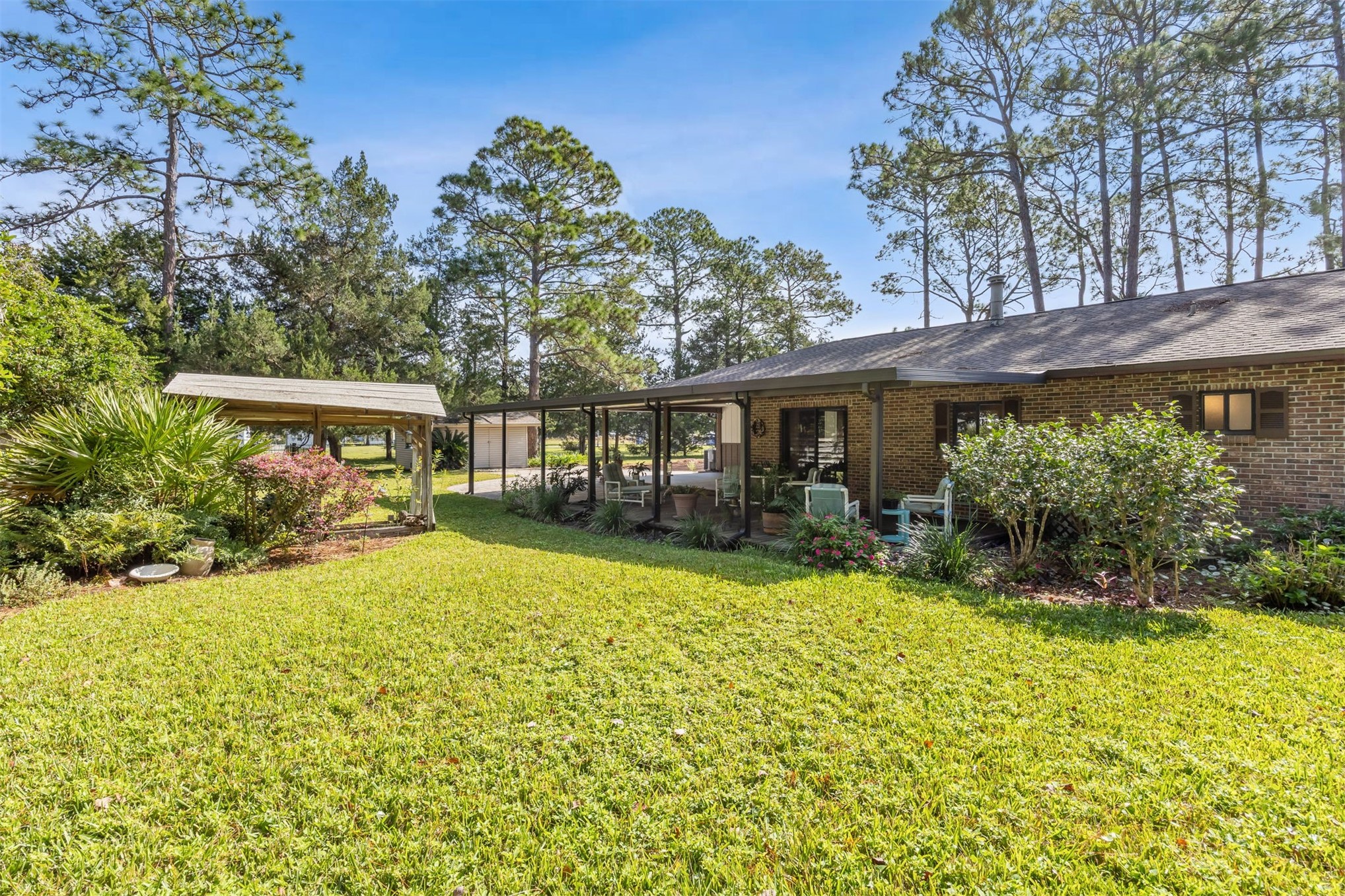 96111 Pirates Bluff Road Yulee, FL 32097 - Photo 36 of 52 a front view of house with yard and green space