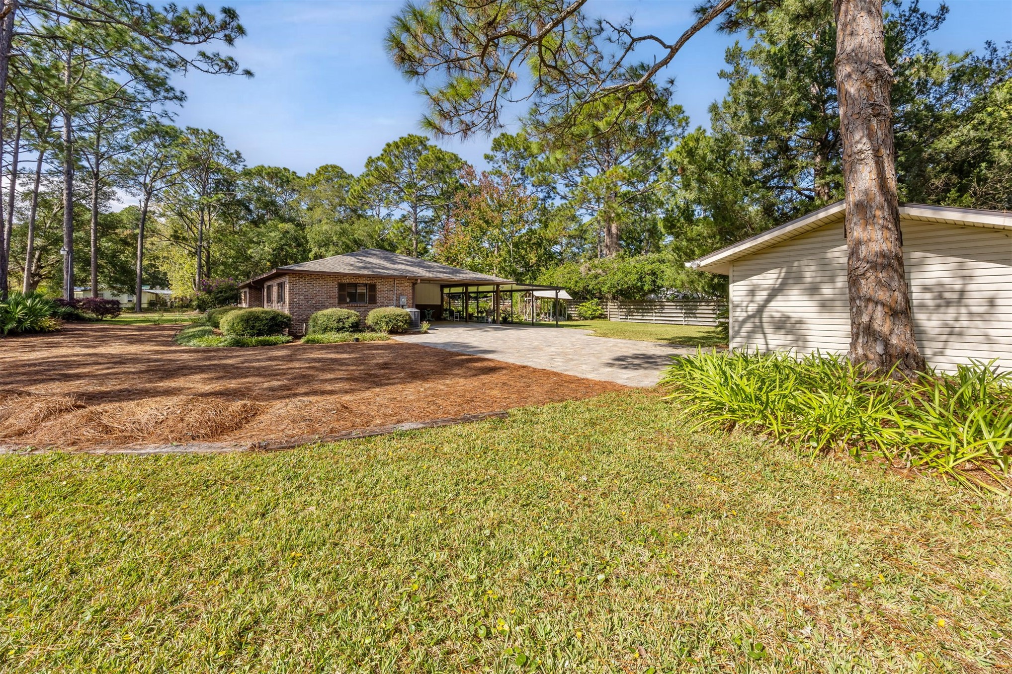 96111 Pirates Bluff Road Yulee, FL 32097 - Photo 37 of 52 a view of a yard with plants and trees