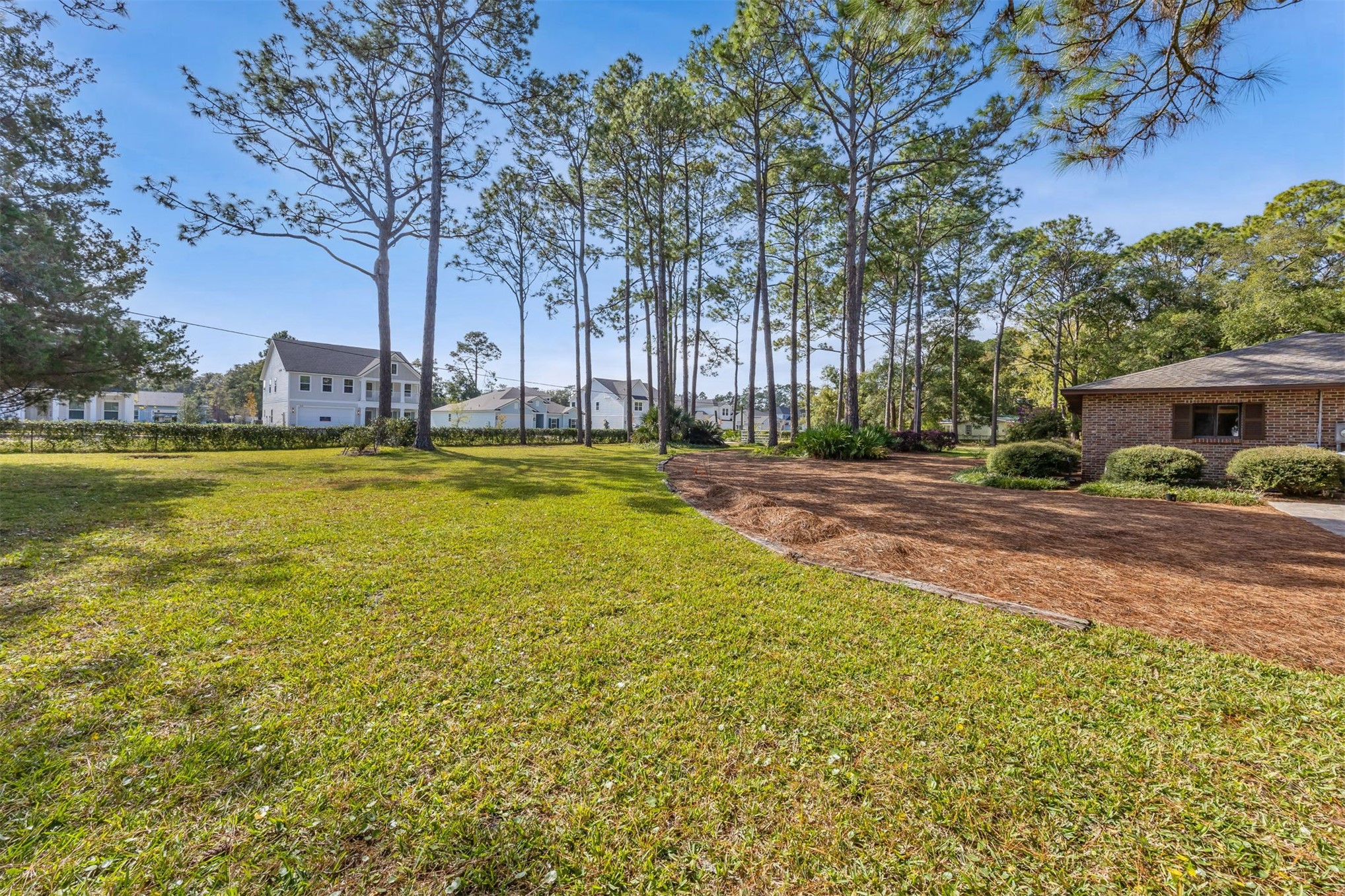96111 Pirates Bluff Road Yulee, FL 32097 - Photo 38 of 52 a view of a swimming pool with an outdoor space and seating area