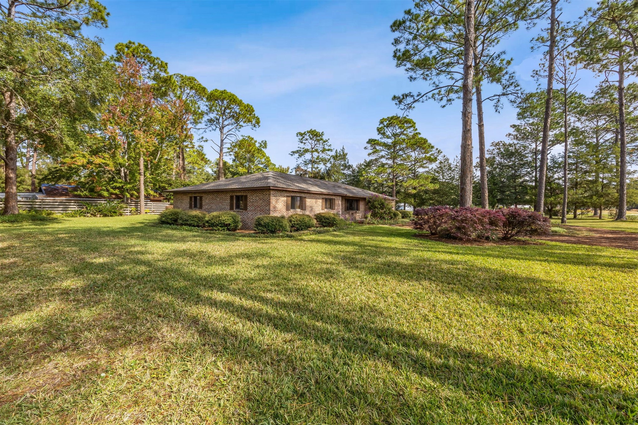 96111 Pirates Bluff Road Yulee, FL 32097 - Photo 51 of 52 a front view of a house with garden
