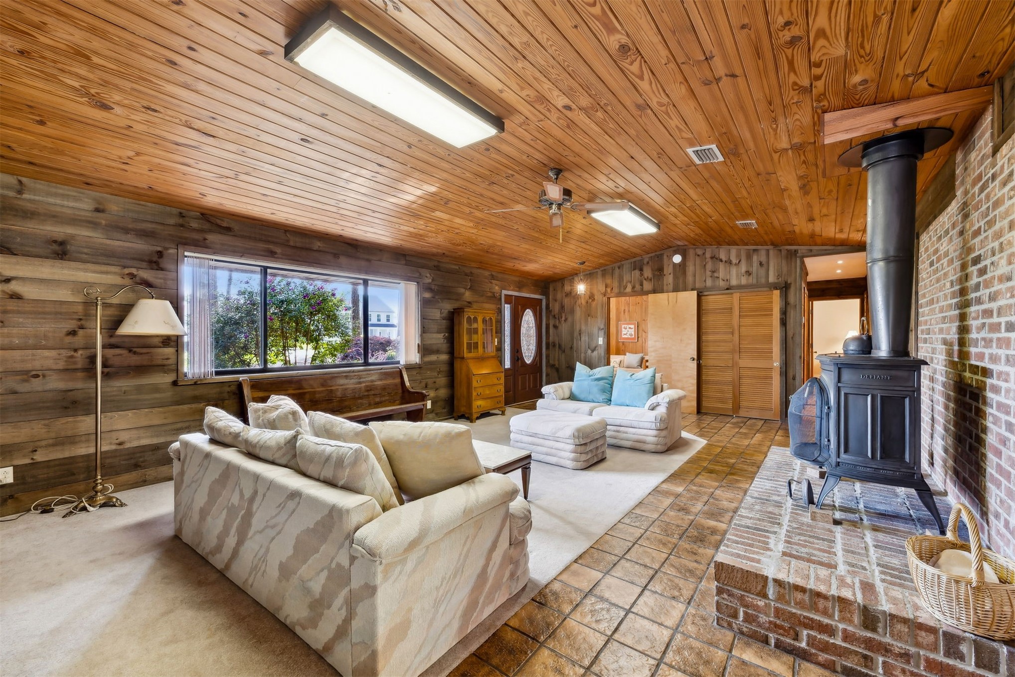 96111 Pirates Bluff Road Yulee, FL 32097 - Photo 9 of 52 a living room with furniture and a floor to ceiling window