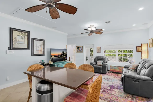 a living room with stainless steel appliances kitchen island granite countertop furniture and a kitchen view