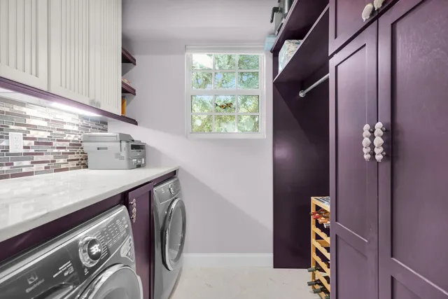 a view of a hallway with a dining table and chair