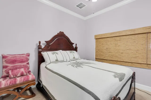 a bedroom with a large bed and a couch